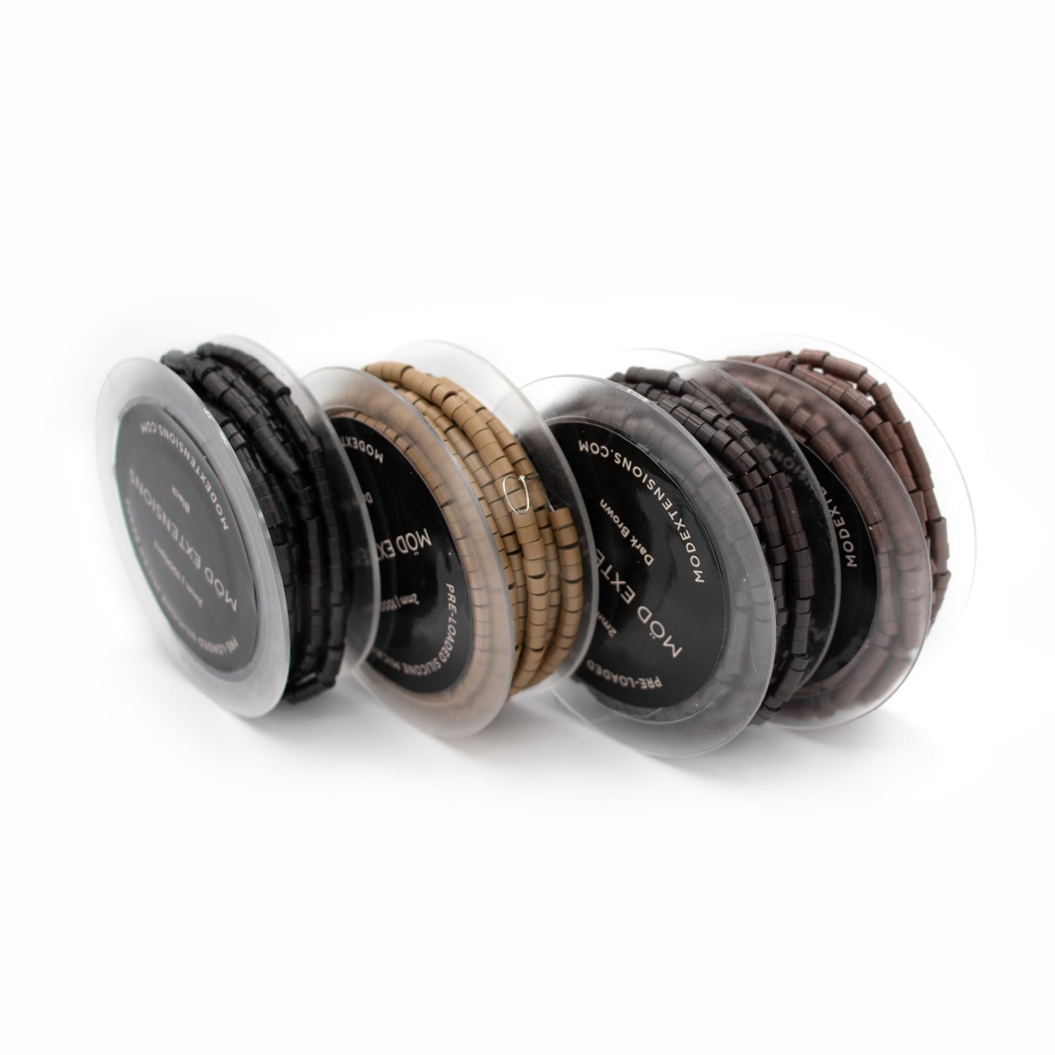 Set of four silicone micro beads with different color options on a white background