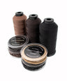Set of four silicone micro beads with 3 spools of nylon thread  in different color options on a white background