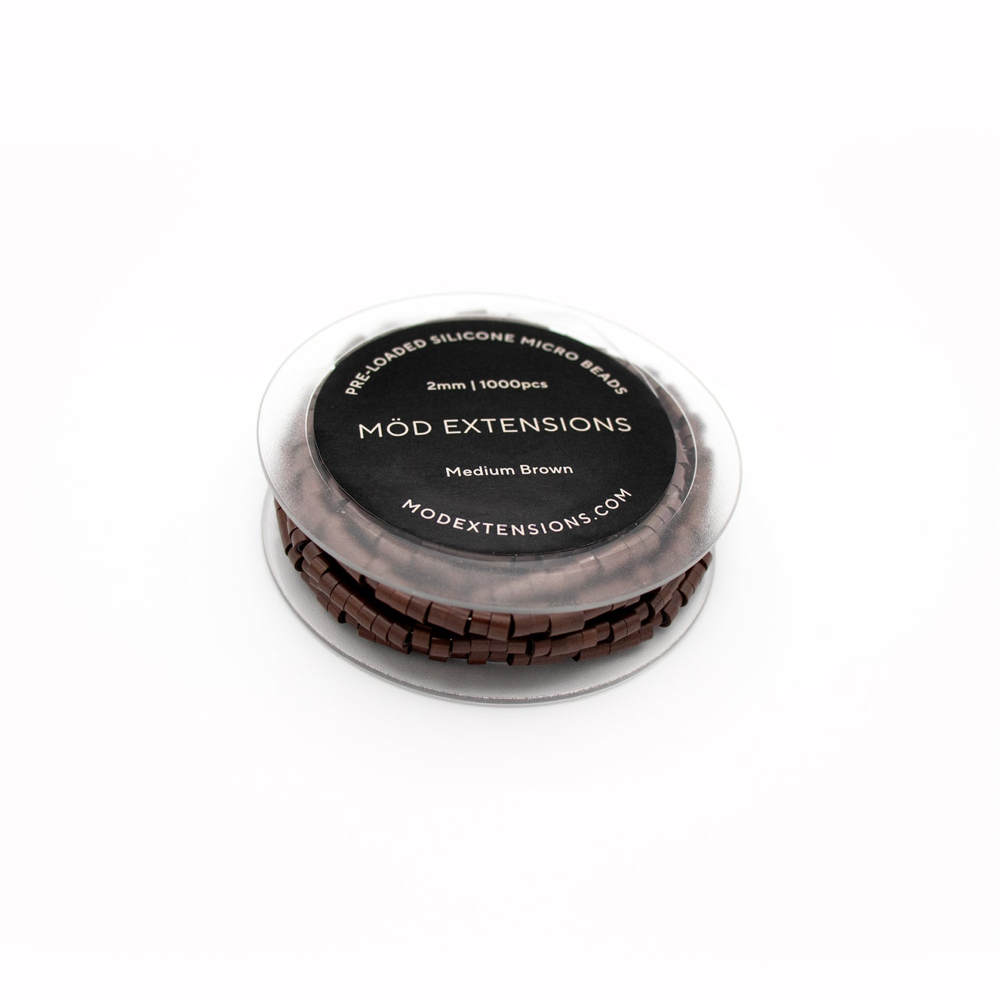 Medium brown pre-loaded silicone micro beads on white background