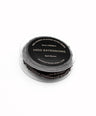 Dark brown pre-loaded silicone micro beads on white background