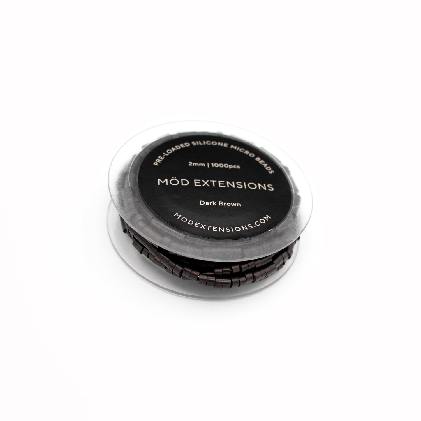 Dark brown pre-loaded silicone micro beads on white background