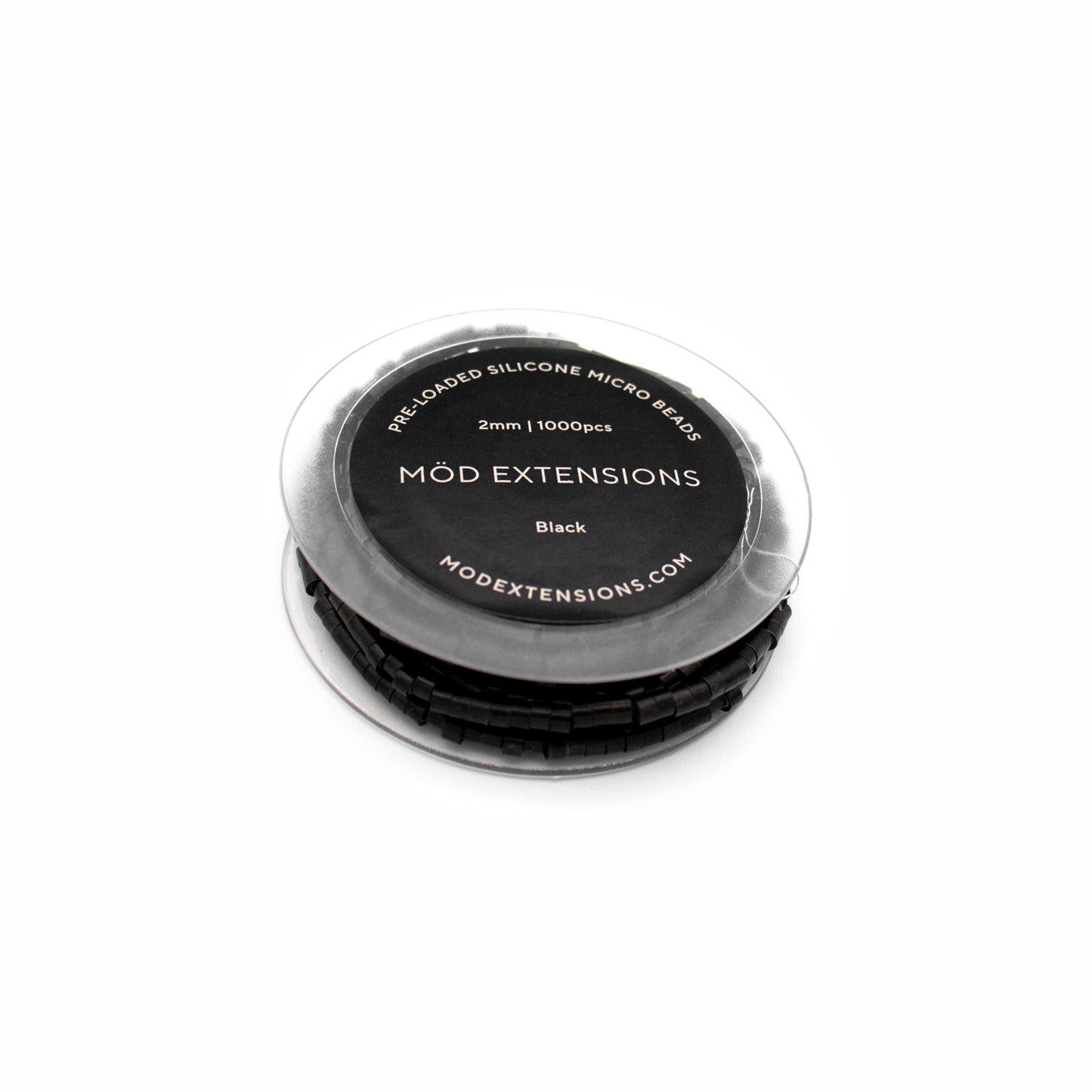 Black pre-loaded silicone micro beads on white background