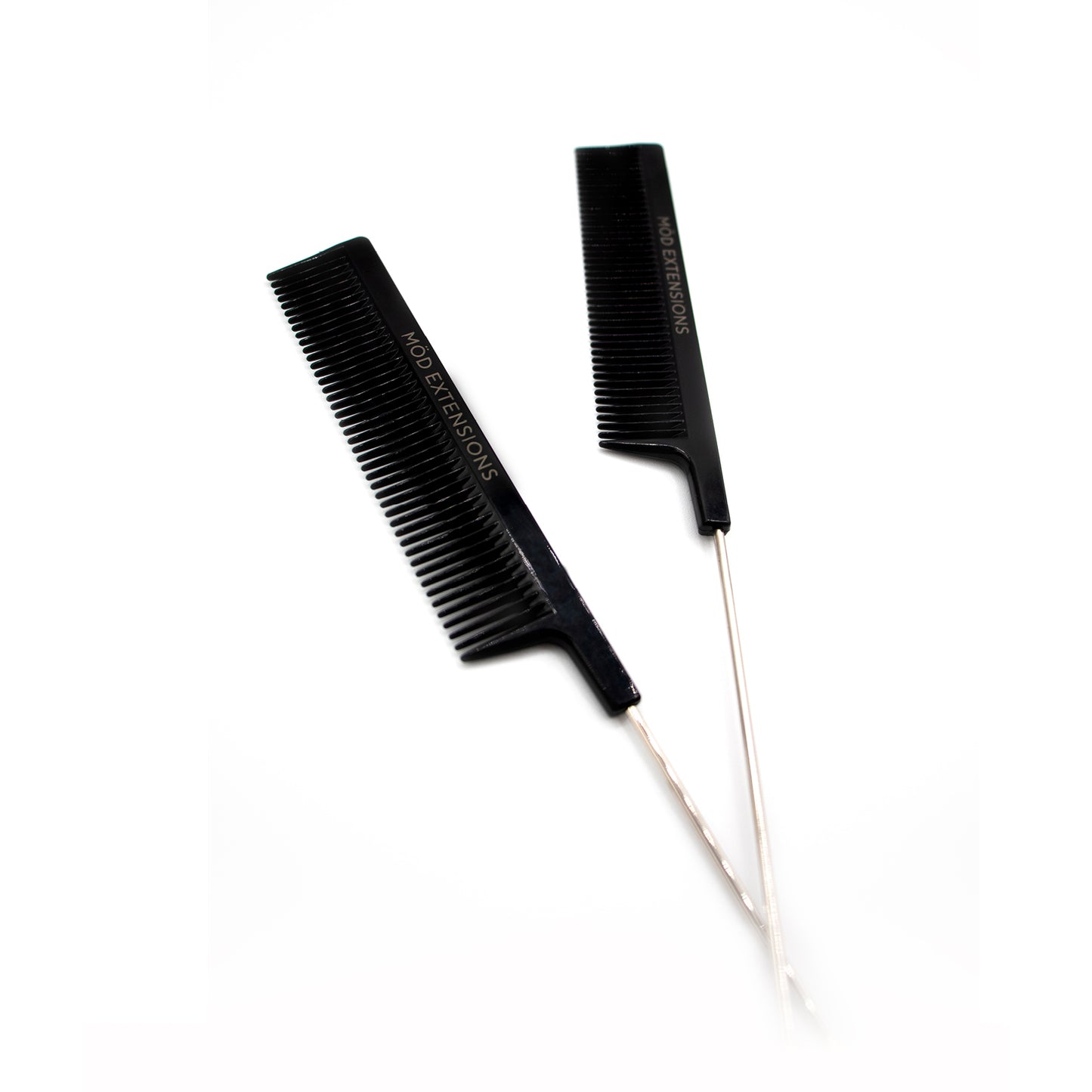Two black metal tail combs on a white background
